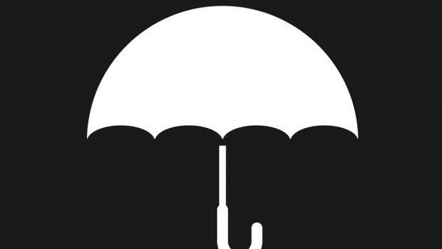 White silhouette of an umbrella against black background